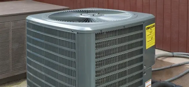 HVAC technician performing preventive maintenance in Columbia, MO